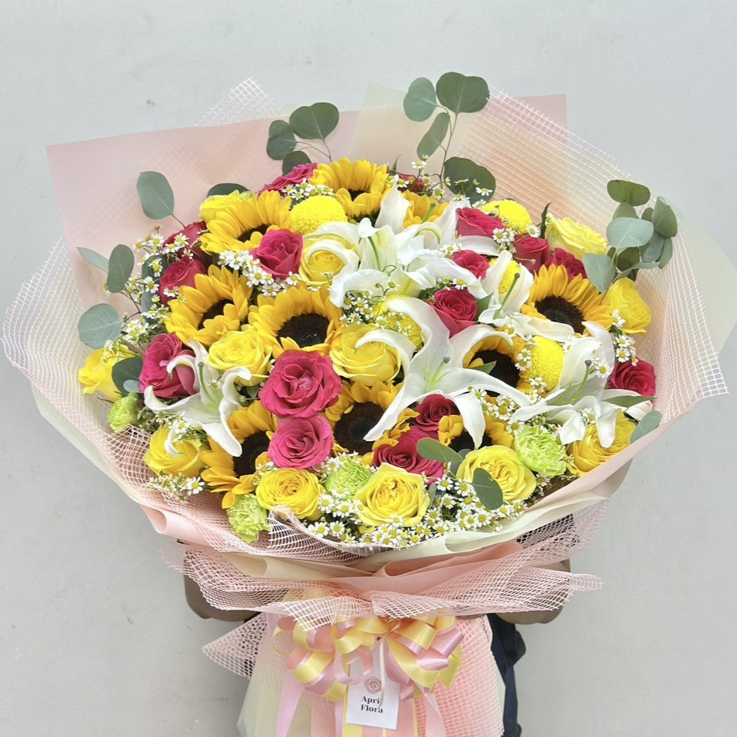 "Blooming Glow" Bouquet of Lily, Sunflower, Rose, Carnation and Daisy With Eucalyptus Leaves