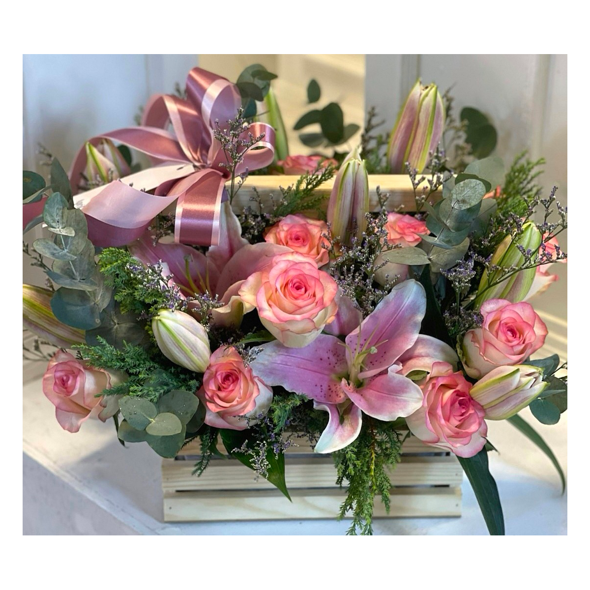 Vintage mixed pink flowers basket