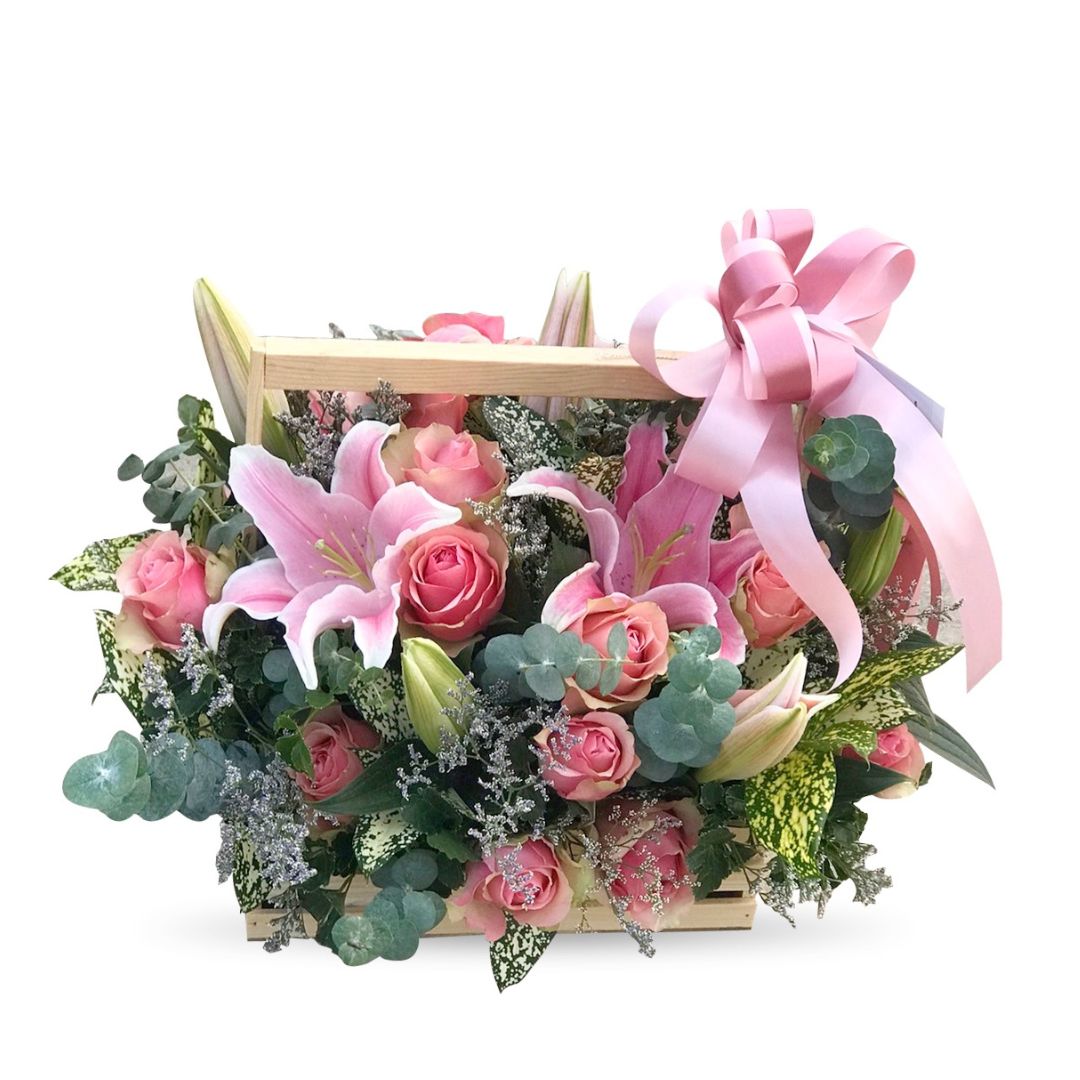 Vintage mixed pink flowers basket